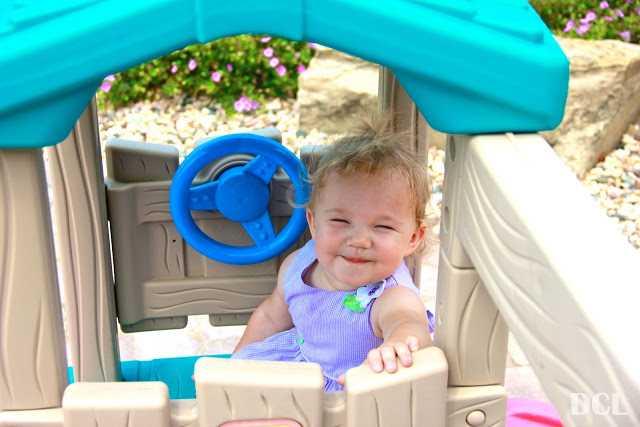 this little girl loves her little playhouse!